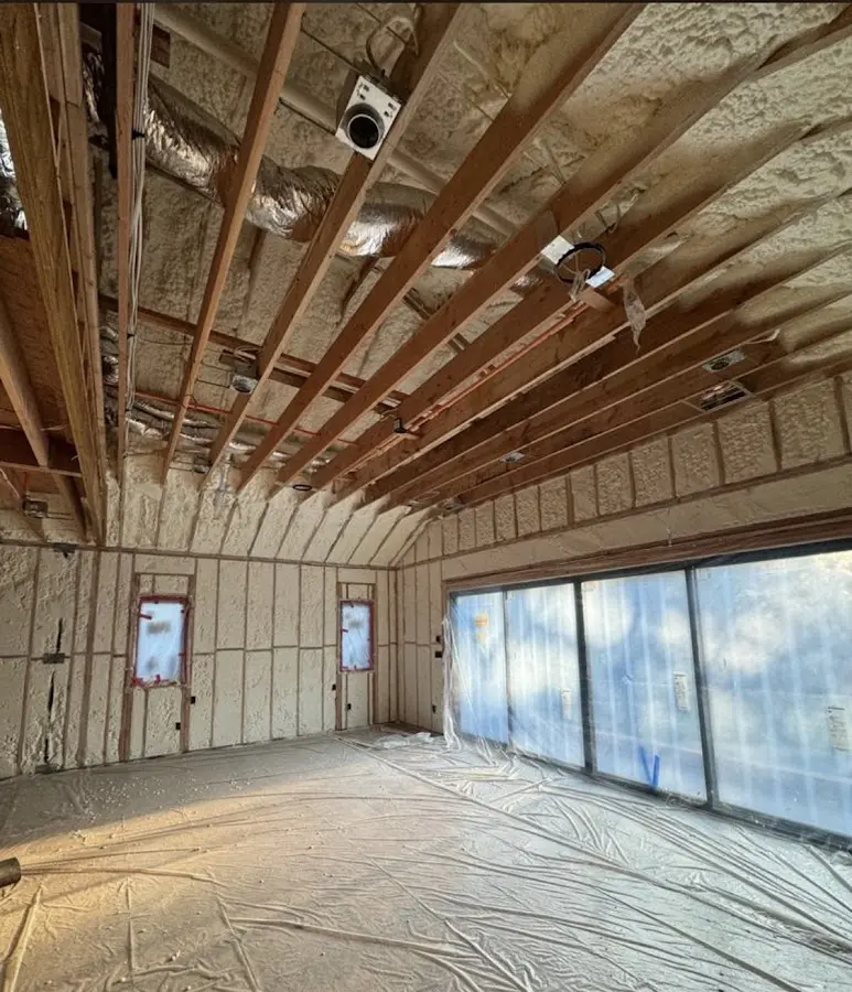 Interior walls and ceiling insulated with spray foam during new construction in Farragut